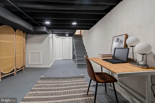 a dinning table and chairs in a room