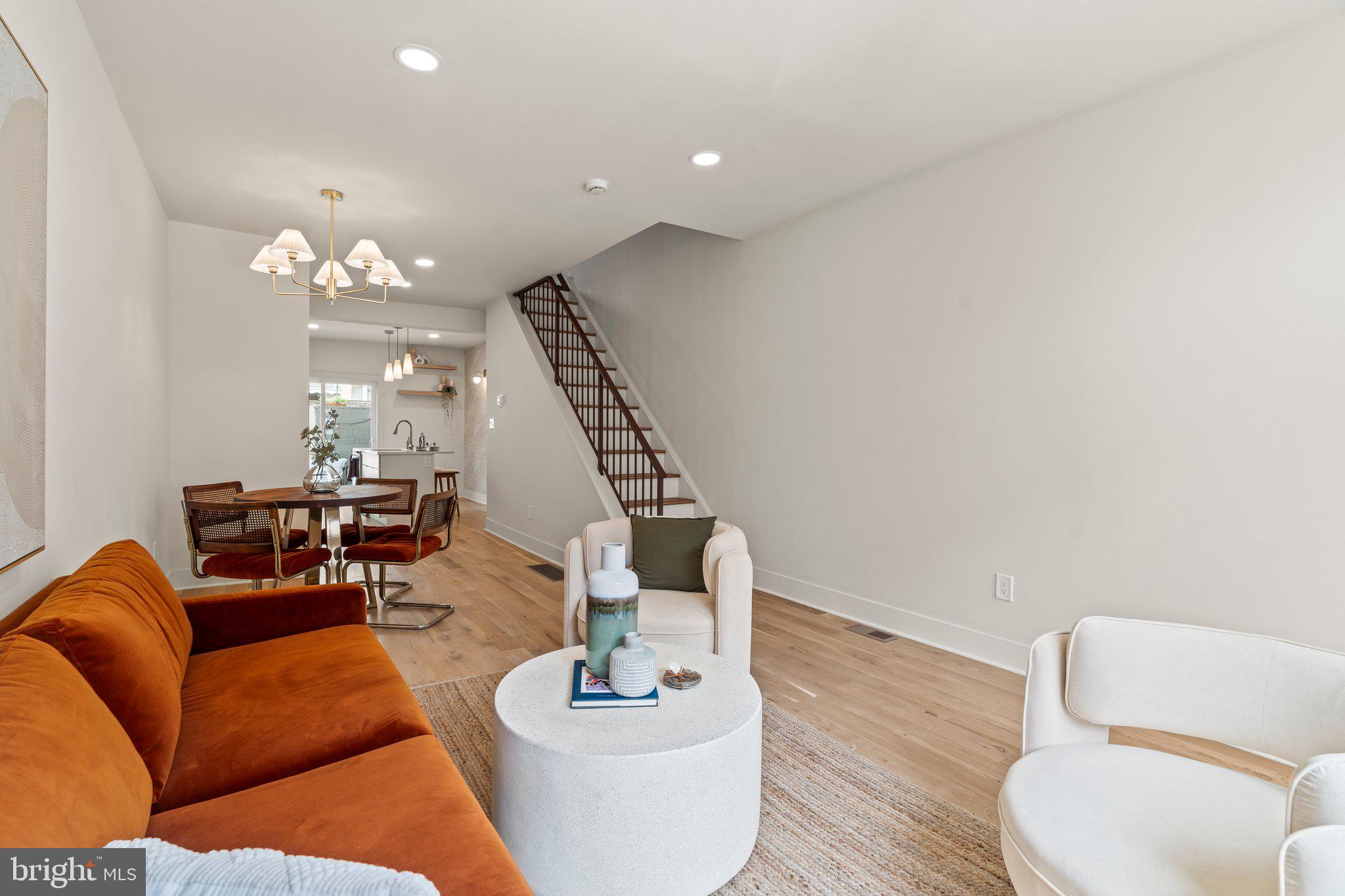 1031 Mercy Street Philadelphia, PA 19148 - Photo 5 of 34 a living room with furniture and a chandelier