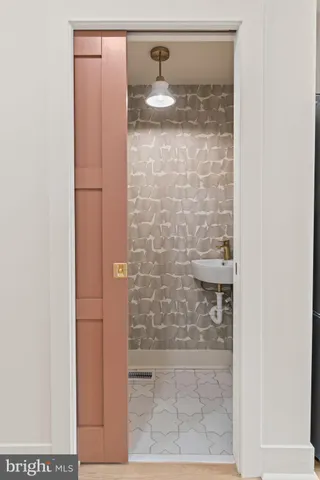 a bathroom with a glass shower door