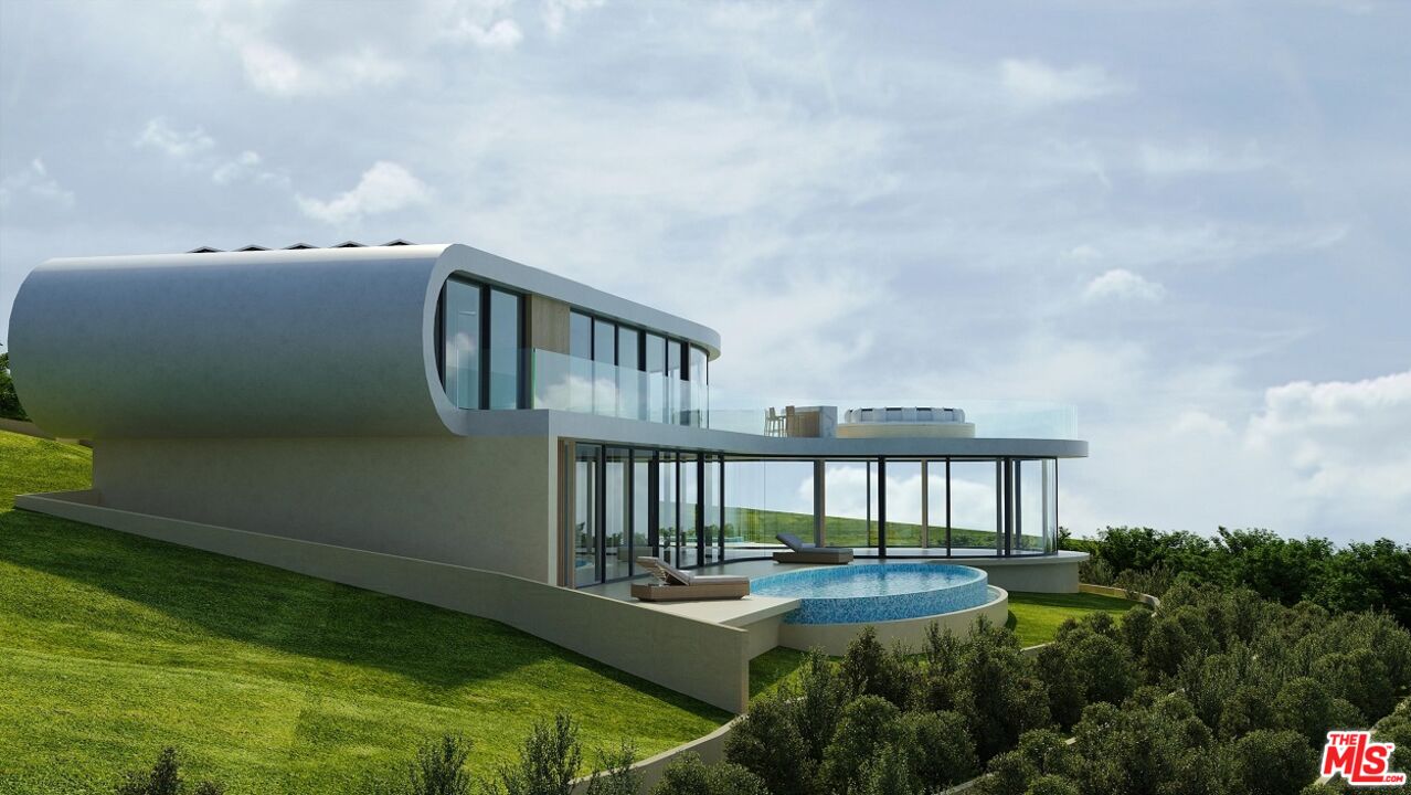 5981 Kanan Dume Road Malibu, CA 90265 - Photo 7 of 10 a view of a house with backyard and sitting area