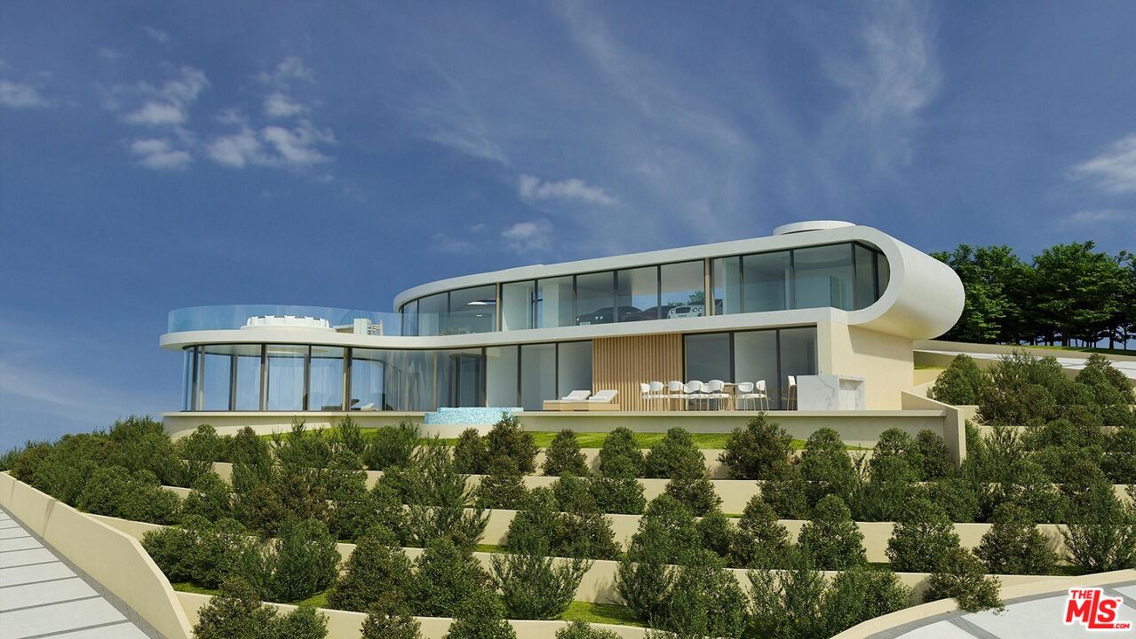 5981 Kanan Dume Road Malibu, CA 90265 - Photo 9 of 10 a front view of a house with a yard