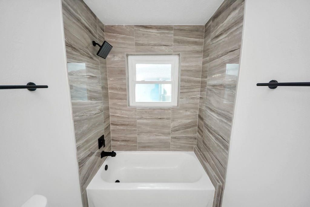 485 Pompano Street Bayou Vista, TX 77563 - Photo 17 of 32 a bathroom with a bathtub