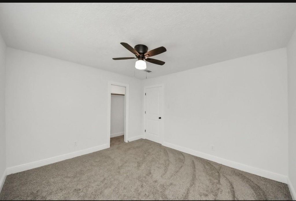 485 Pompano Street Bayou Vista, TX 77563 - Photo 19 of 32 a view of cabinets and a ceiling fan