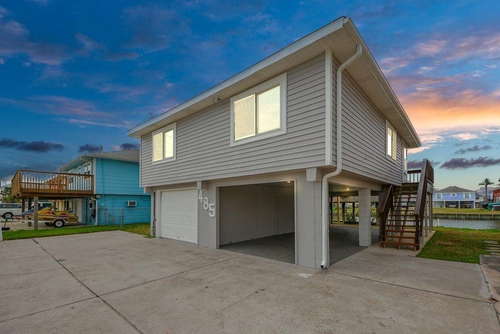 485 Pompano Street Bayou Vista, TX 77563 - Photo 29 of 32 a view of a house with a yard and garage