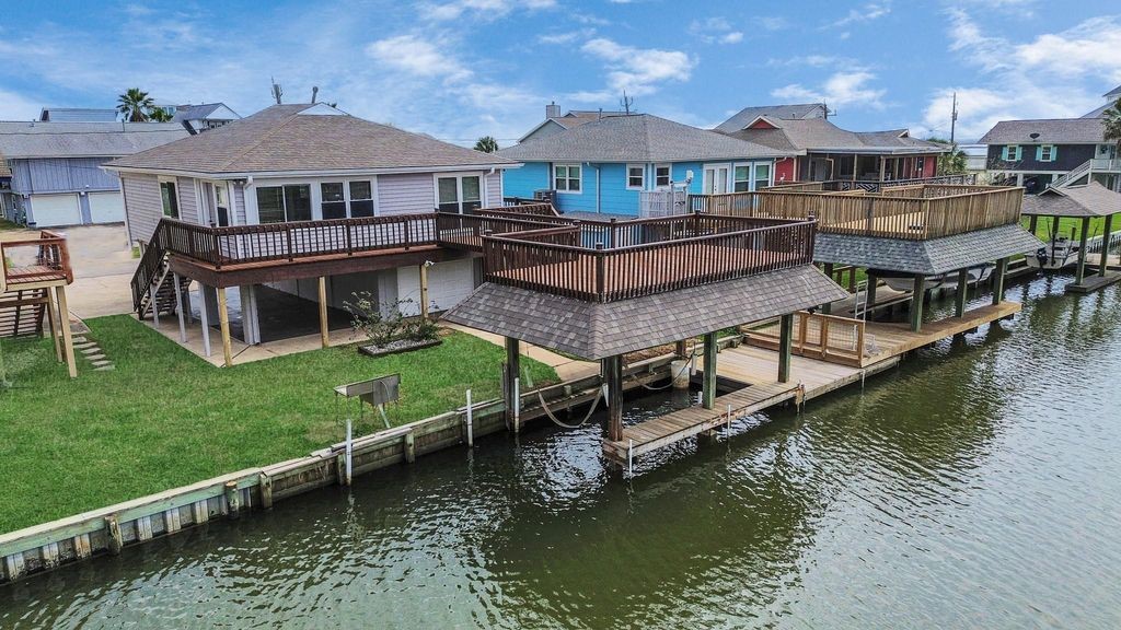 485 Pompano Street Bayou Vista, TX 77563 - Photo 4 of 32 a front view of a house with a boat