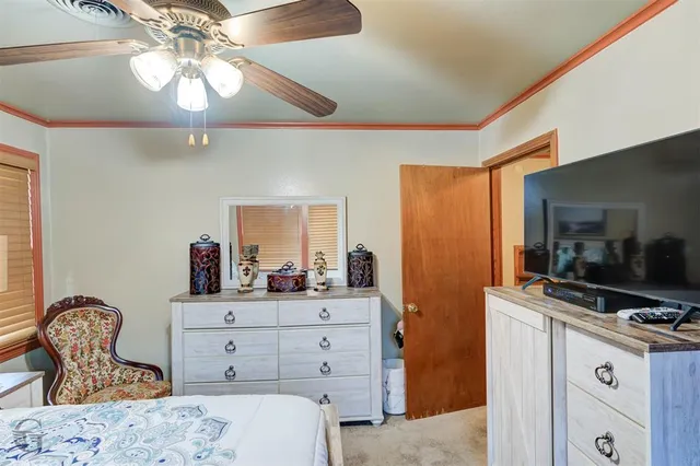 a bedroom with a bed and furniture