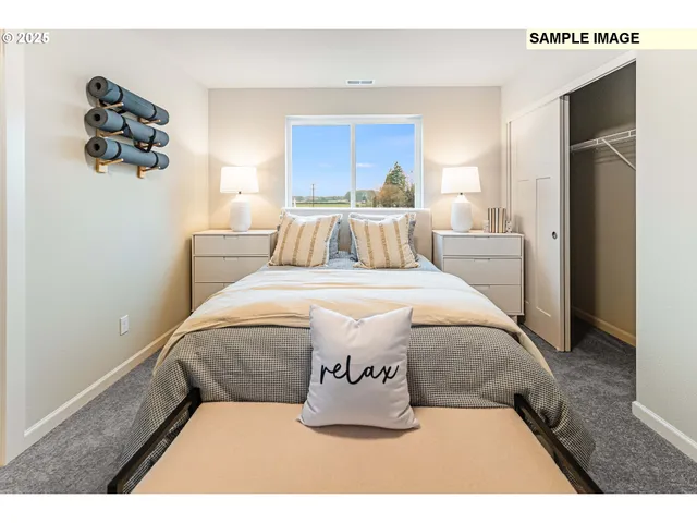 a bed room with a bed and a night stand