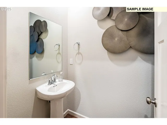 a bathroom with a sink and mirror