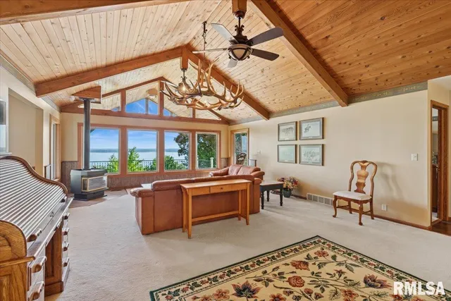 a living room with furniture a fireplace and a table