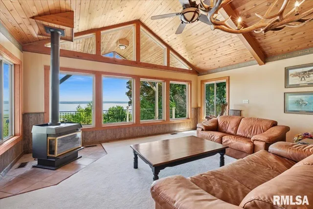a kitchen with a sink stainless steel appliances a counter space and a window