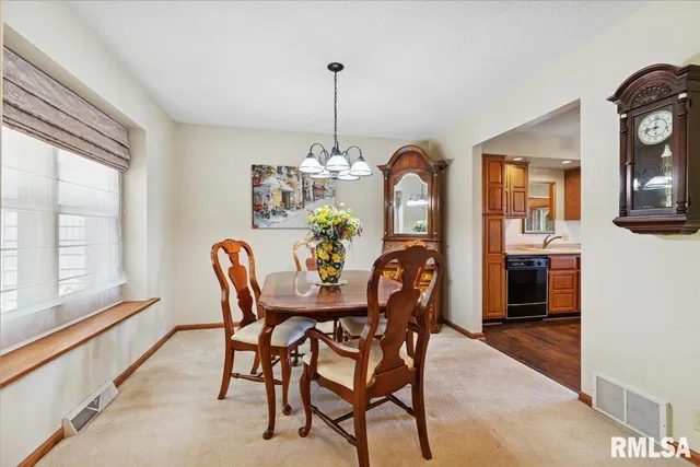 a view of a backyard with sitting area