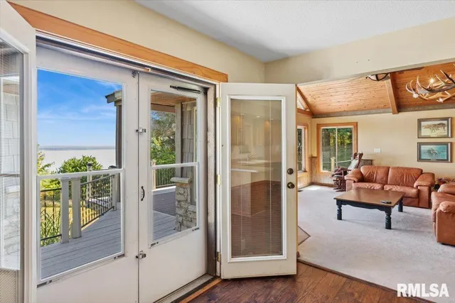 a view of a wooden deck and a yard