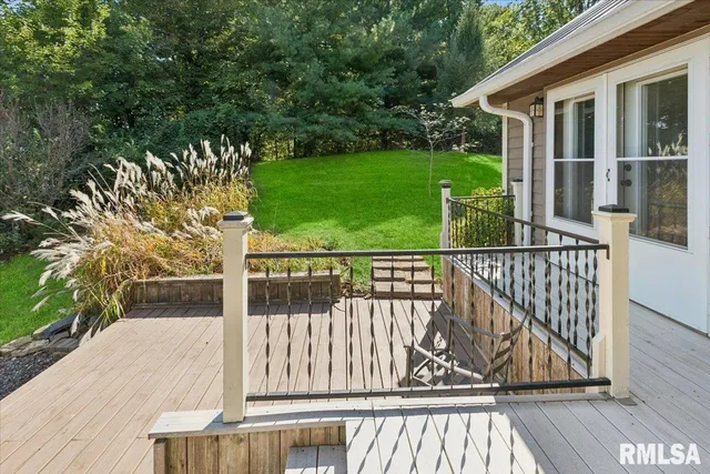a view of a porch with wooden floor and outdoor space