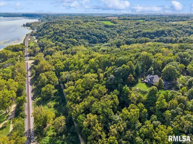 a room with pool table and windows