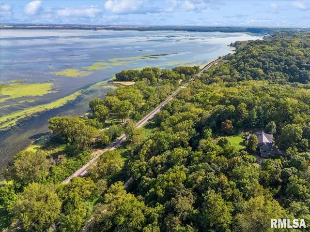 a bathroom with a double vanity sink a mirror and a shower