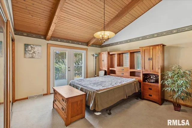 a view of a porch with furniture and floor to ceiling window