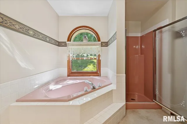 an aerial view of a houses with a yard