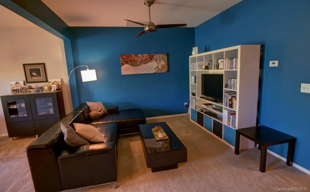 290 River Clay Road, Unit 222 Fort Mill, SC 29708 - Photo 3 of 12 a bedroom with furniture and a flat screen tv
