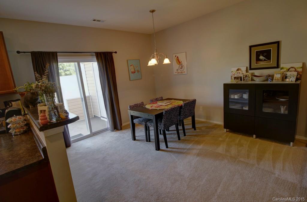 290 River Clay Road, Unit 222 Fort Mill, SC 29708 - Photo 5 of 12 a room with furniture and a flat screen tv