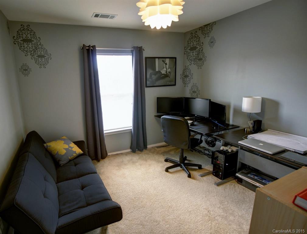 290 River Clay Road, Unit 222 Fort Mill, SC 29708 - Photo 8 of 12 a livingroom with workspace and a couch