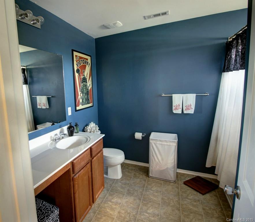 290 River Clay Road, Unit 222 Fort Mill, SC 29708 - Photo 10 of 12 a bathroom with a sink a toilet and mirror