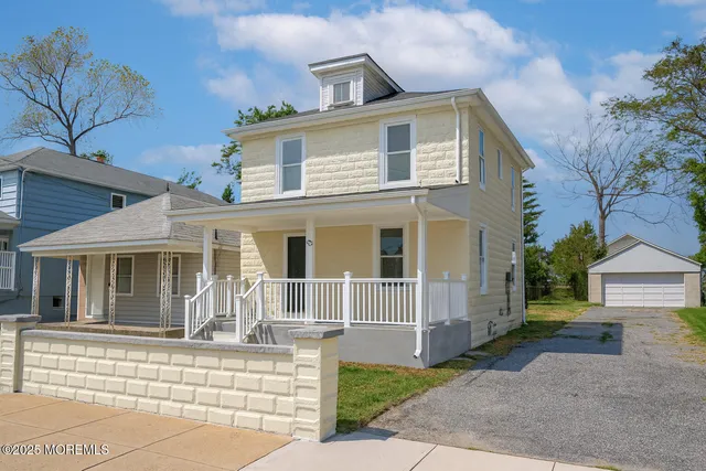 a front view of a house with a porch