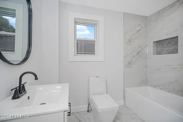 a bathroom with a sink a bathtub and a shower