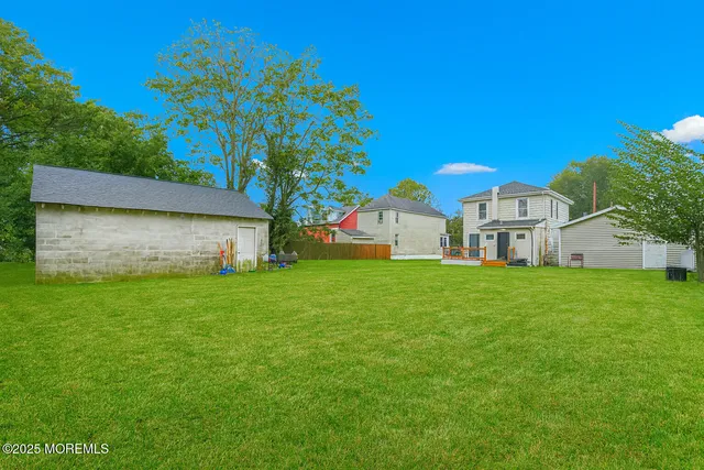 a view of an house with backyard space and garden
