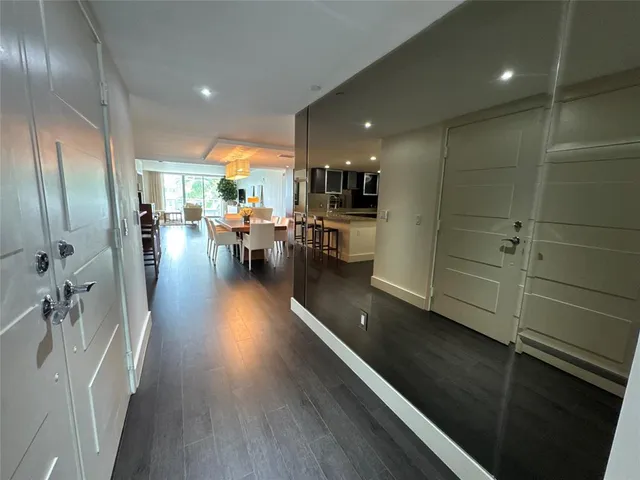 a view of a living room and dining room