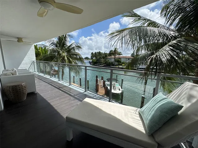 a view of a balcony with chairs