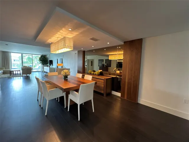 a view of a dining area with furniture and wooden floor