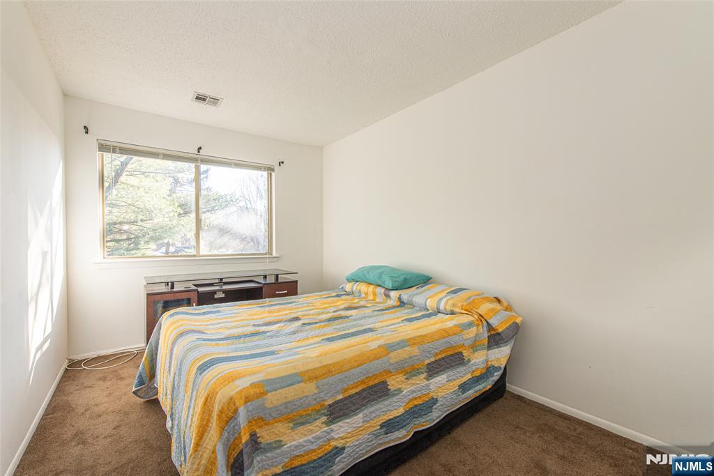 7 Drake Lane Roxbury Township, NJ 07852 - Photo 15 of 35 a bedroom with a bed and window