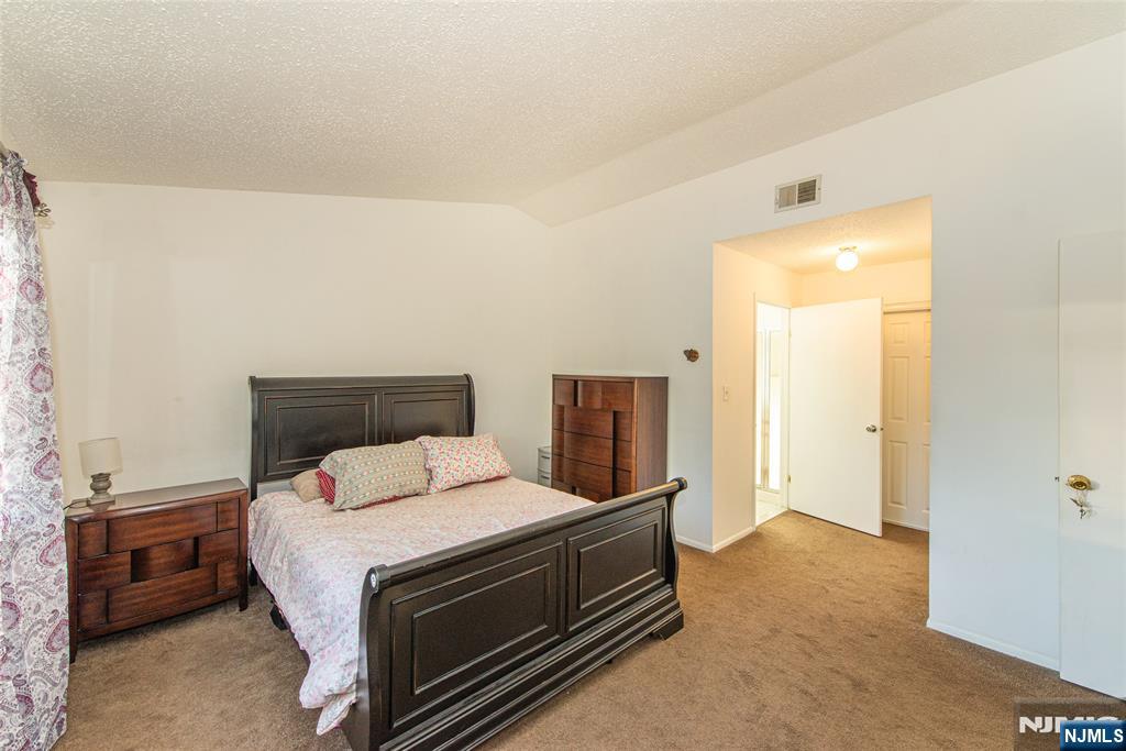 7 Drake Lane Roxbury Township, NJ 07852 - Photo 19 of 35 a bed room with a bed and a night stand