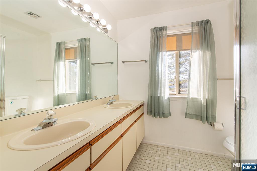 7 Drake Lane Roxbury Township, NJ 07852 - Photo 20 of 35 a bathroom with a tub sink and mirror