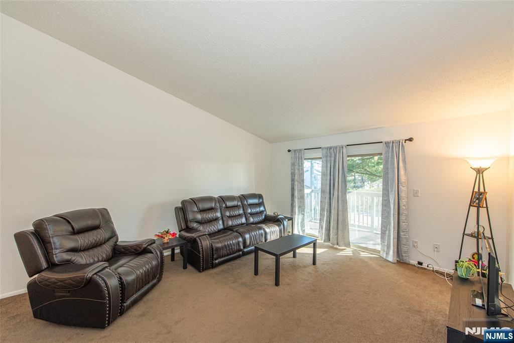 7 Drake Lane Roxbury Township, NJ 07852 - Photo 5 of 35 a living room with furniture a window and a flat screen tv