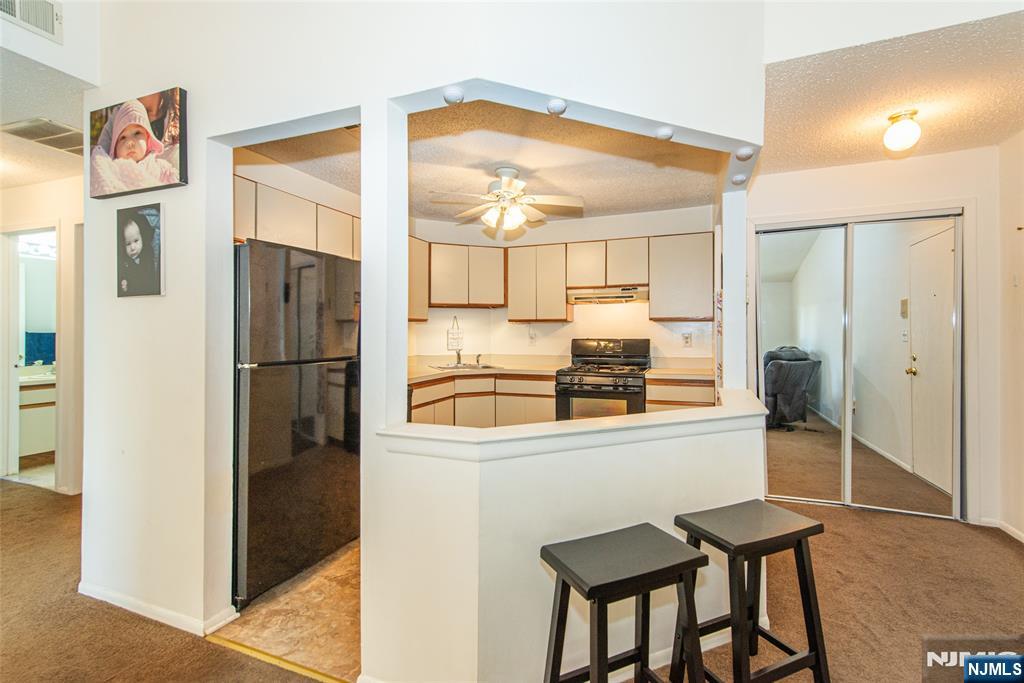 7 Drake Lane Roxbury Township, NJ 07852 - Photo 7 of 35 a kitchen with stainless steel appliances granite countertop a refrigerator and a stove top oven