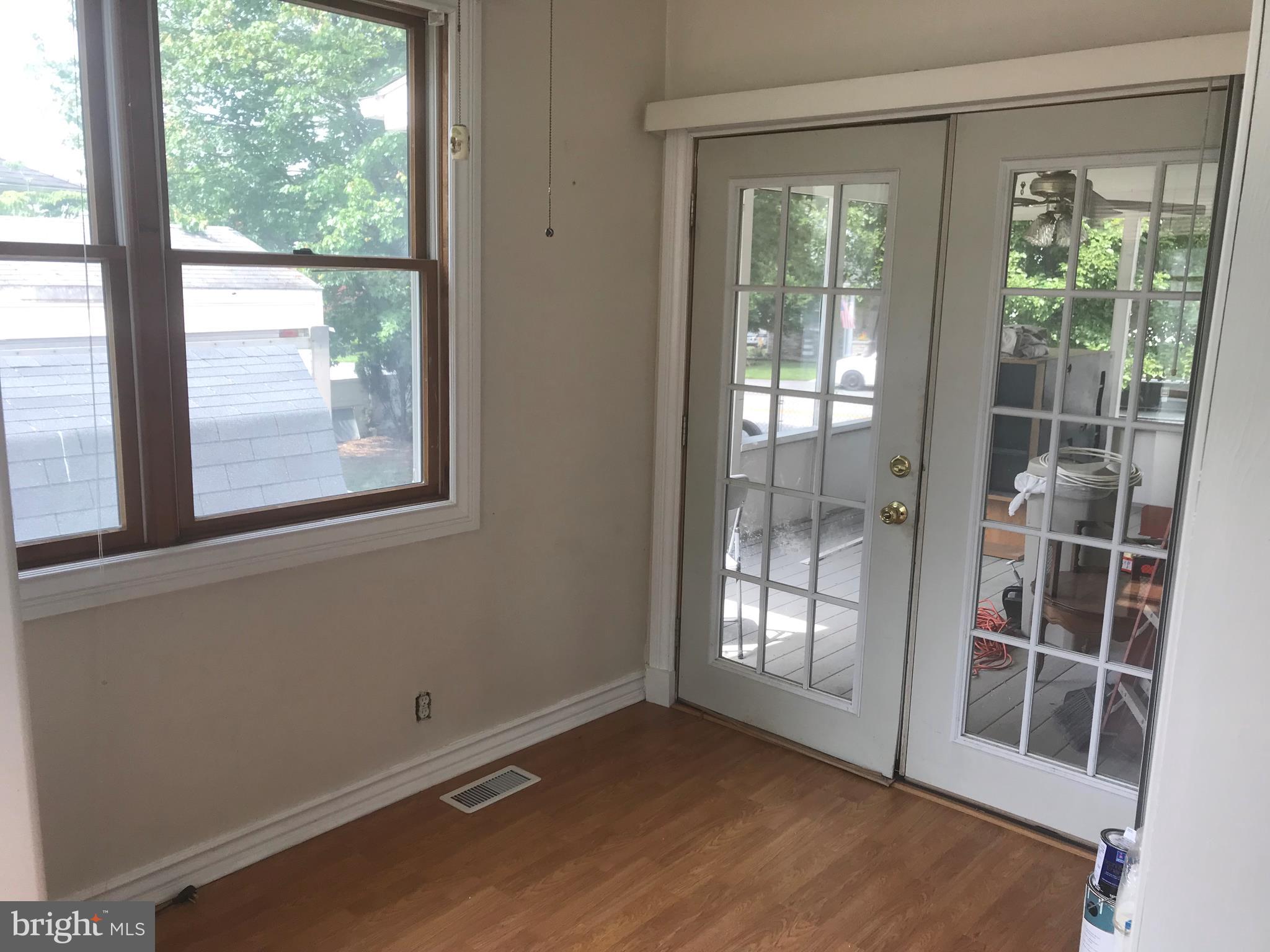 297 Townsend Road Essex, MD 21221 - Photo 10 of 39 Den leads to screened porch