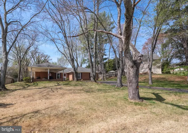 a house that has a tree in front of it