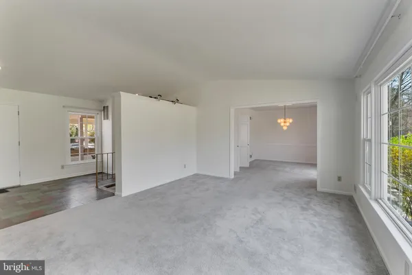 a view of a room with windows and cabinet