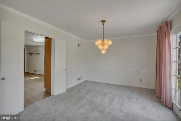 a kitchen with a refrigerator and a sink