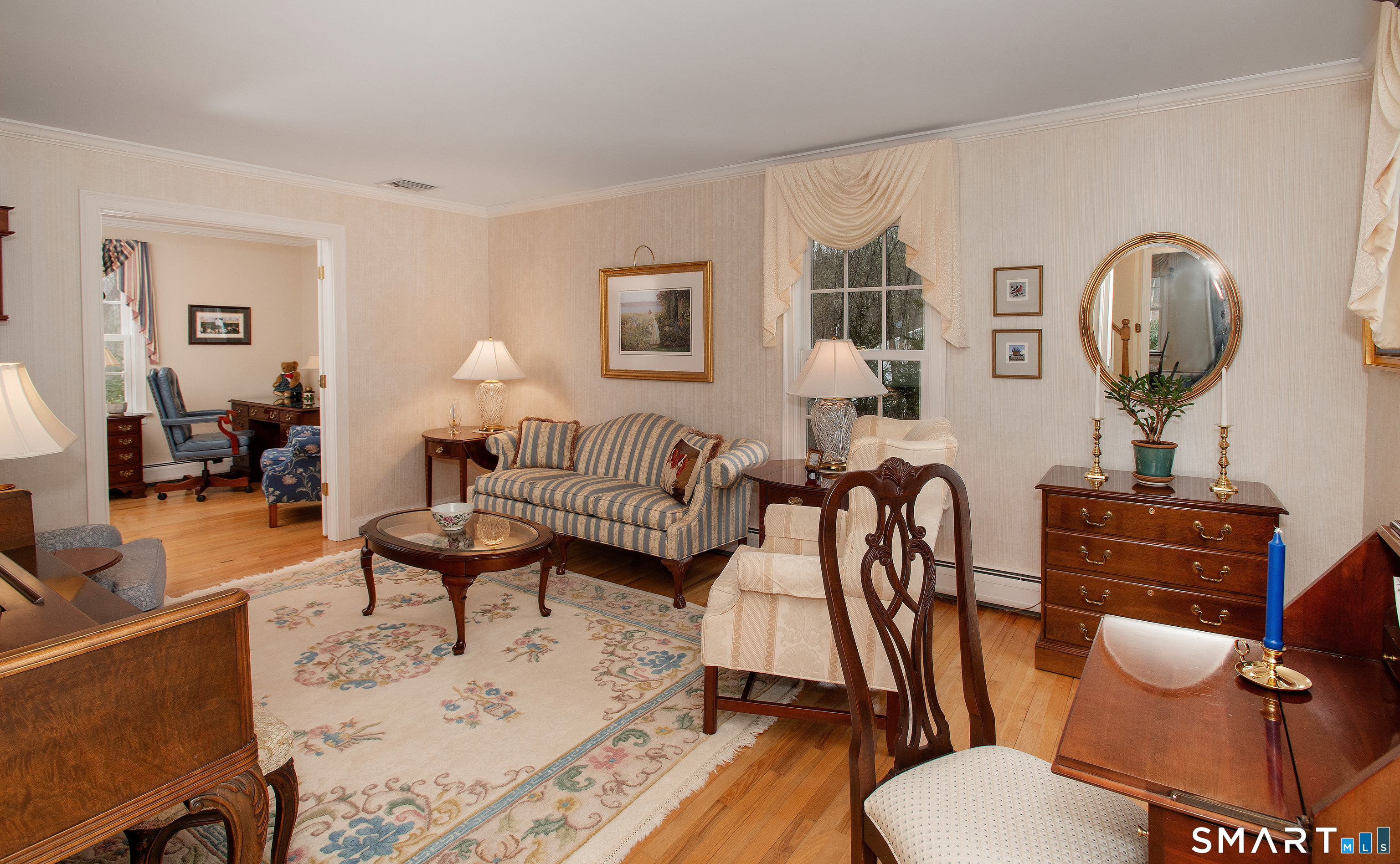 15 Twopence Road Ridgefield, CT 06877 - Photo 11 of 42 a living room with furniture a rug and a mirror