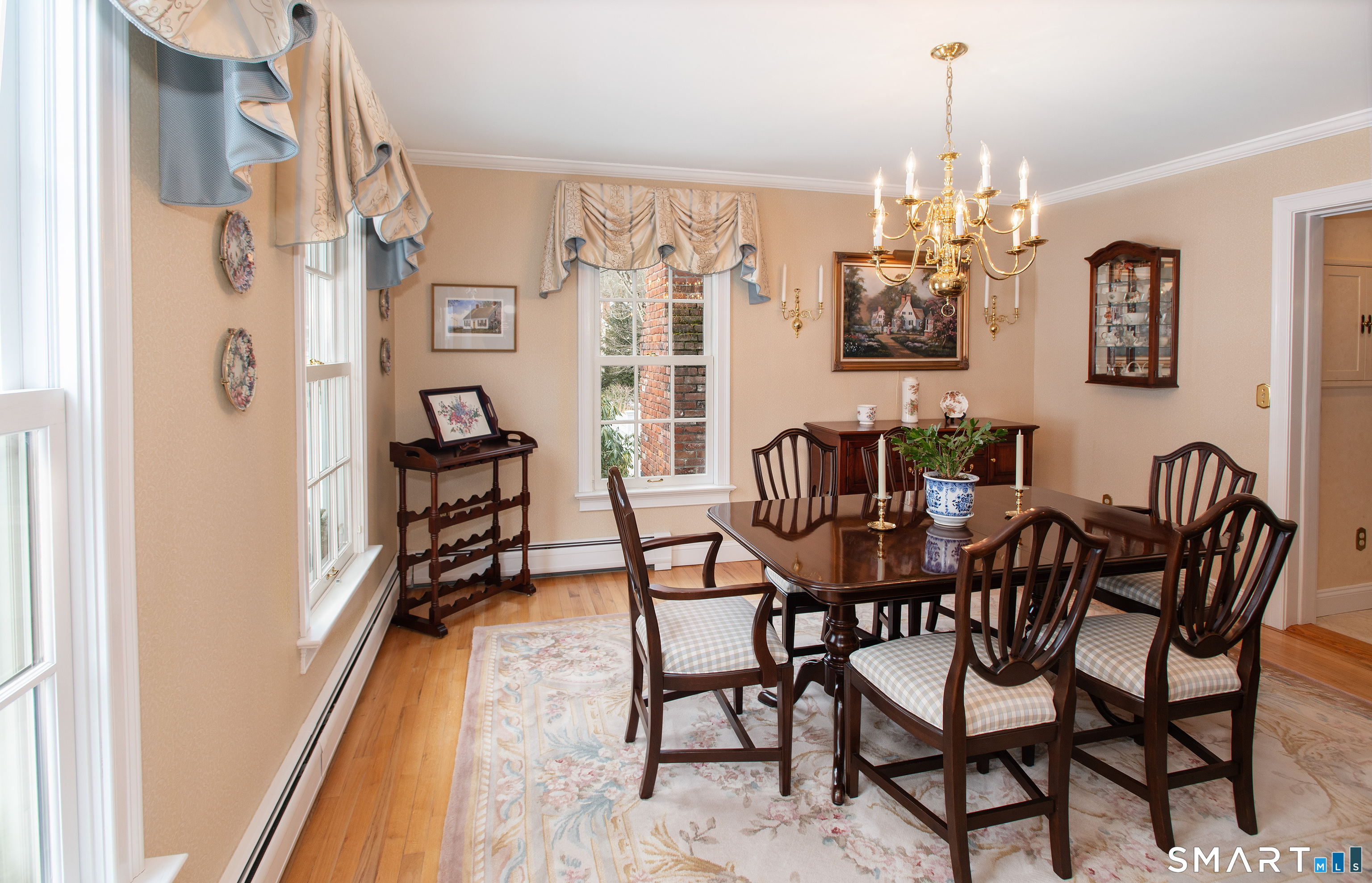 15 Twopence Road Ridgefield, CT 06877 - Photo 13 of 42 a view of a dining room with furniture and chandelier