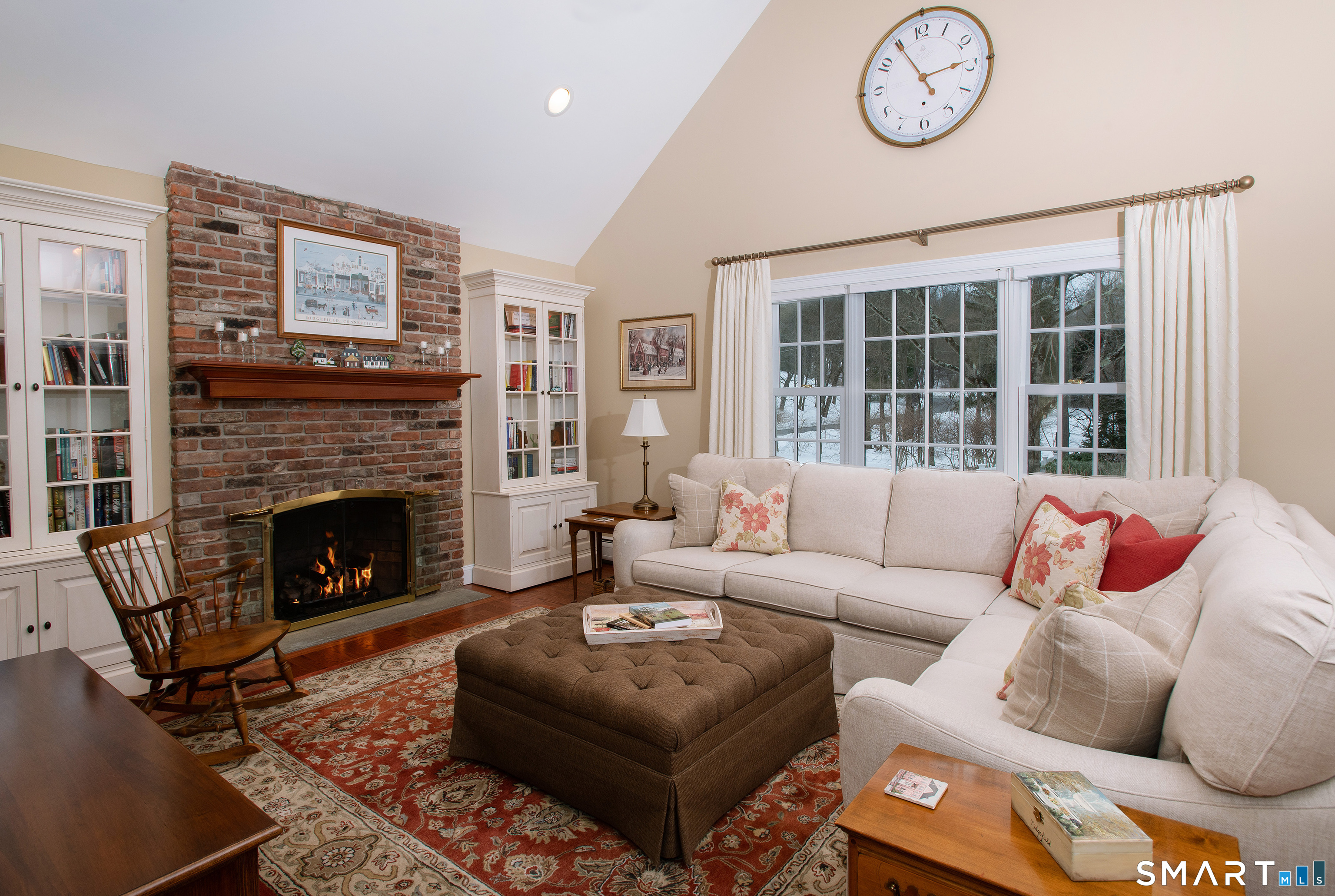 15 Twopence Road Ridgefield, CT 06877 - Photo 16 of 42 a living room with furniture a large window and a fireplace