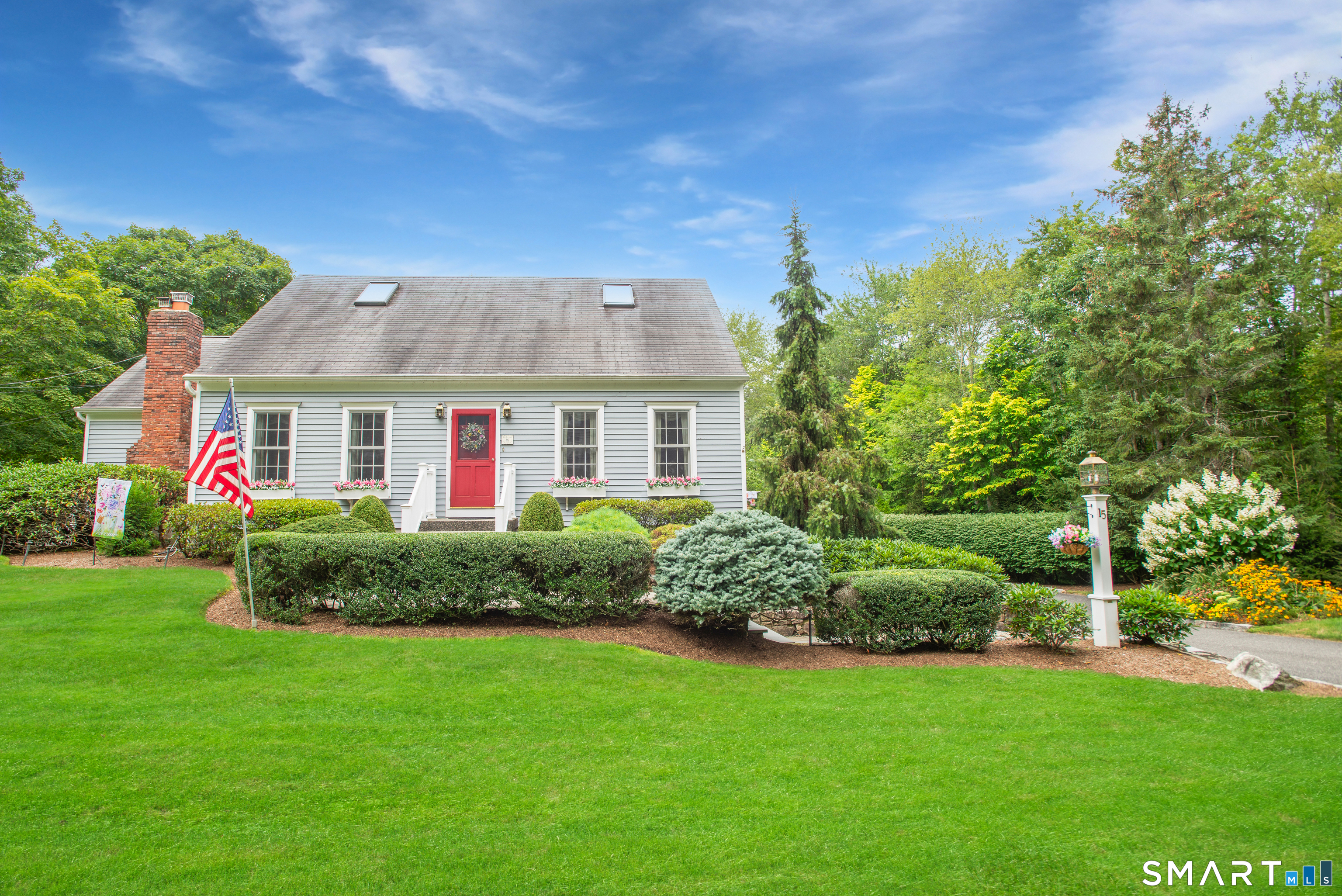 15 Twopence Road Ridgefield, CT 06877 - Photo 2 of 42 a front view of house with yard and green space
