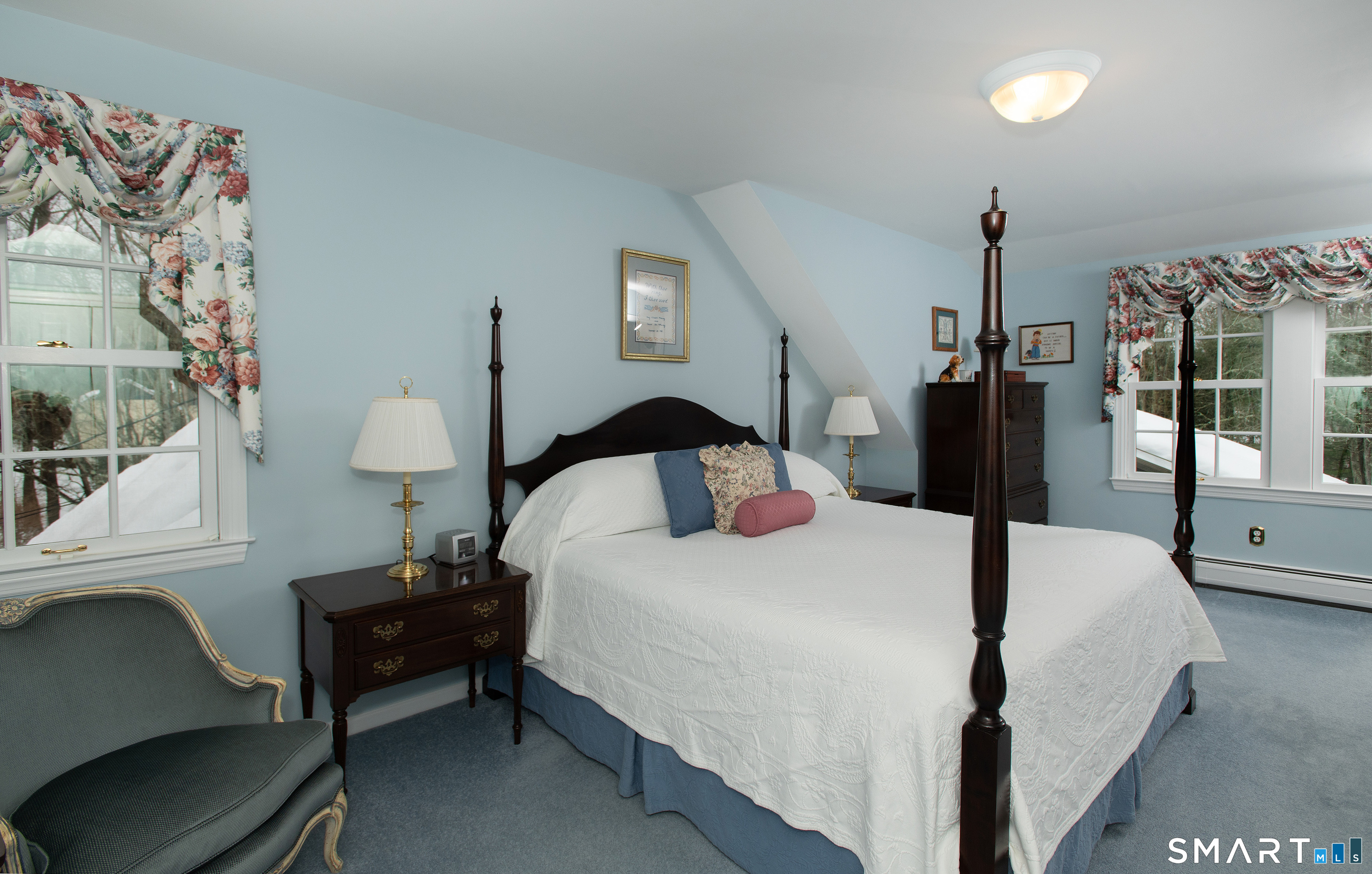 15 Twopence Road Ridgefield, CT 06877 - Photo 22 of 42 a bedroom with a bed and a lamp next to a window