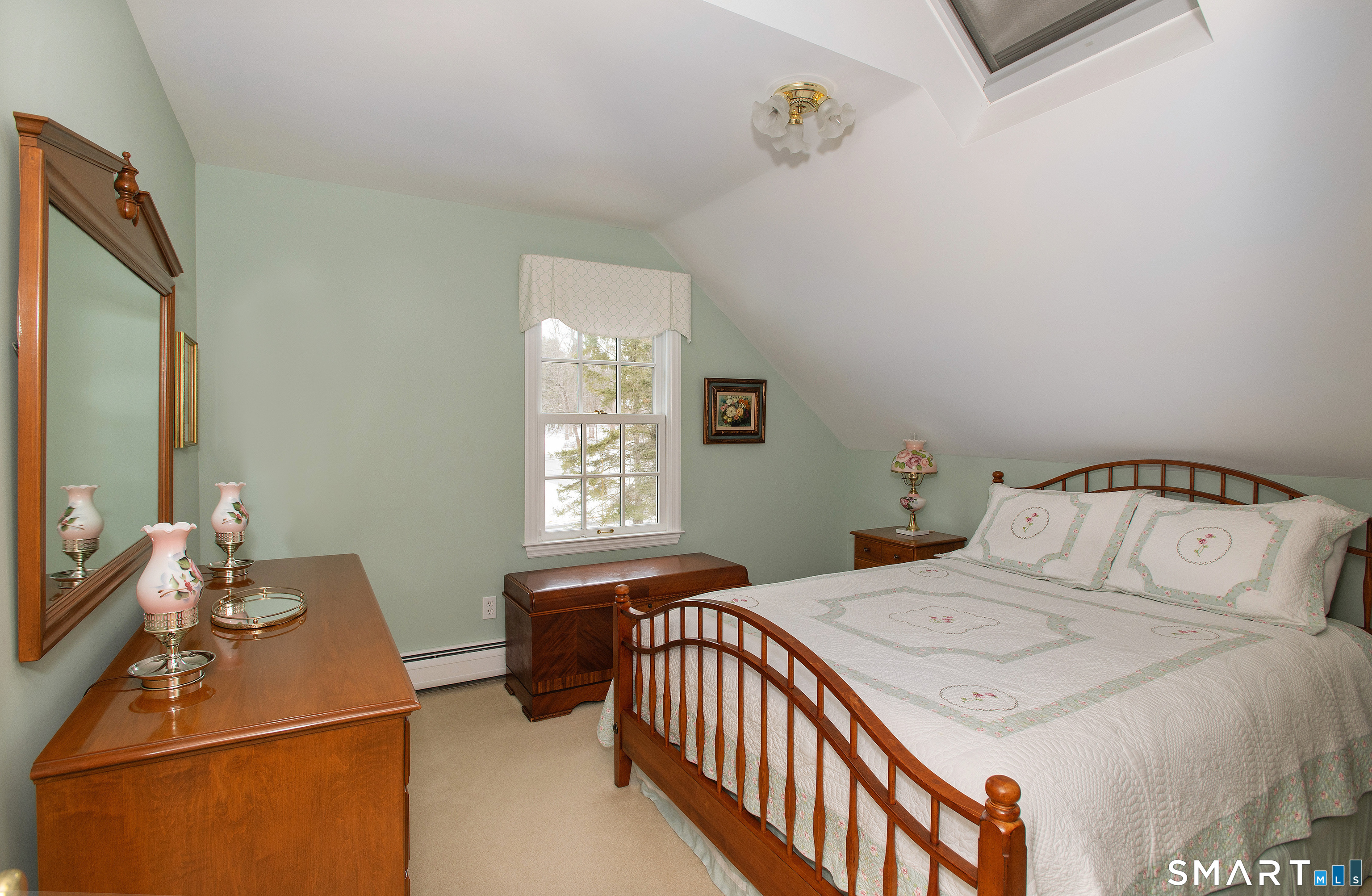 15 Twopence Road Ridgefield, CT 06877 - Photo 25 of 42 a bedroom with a bed and a window