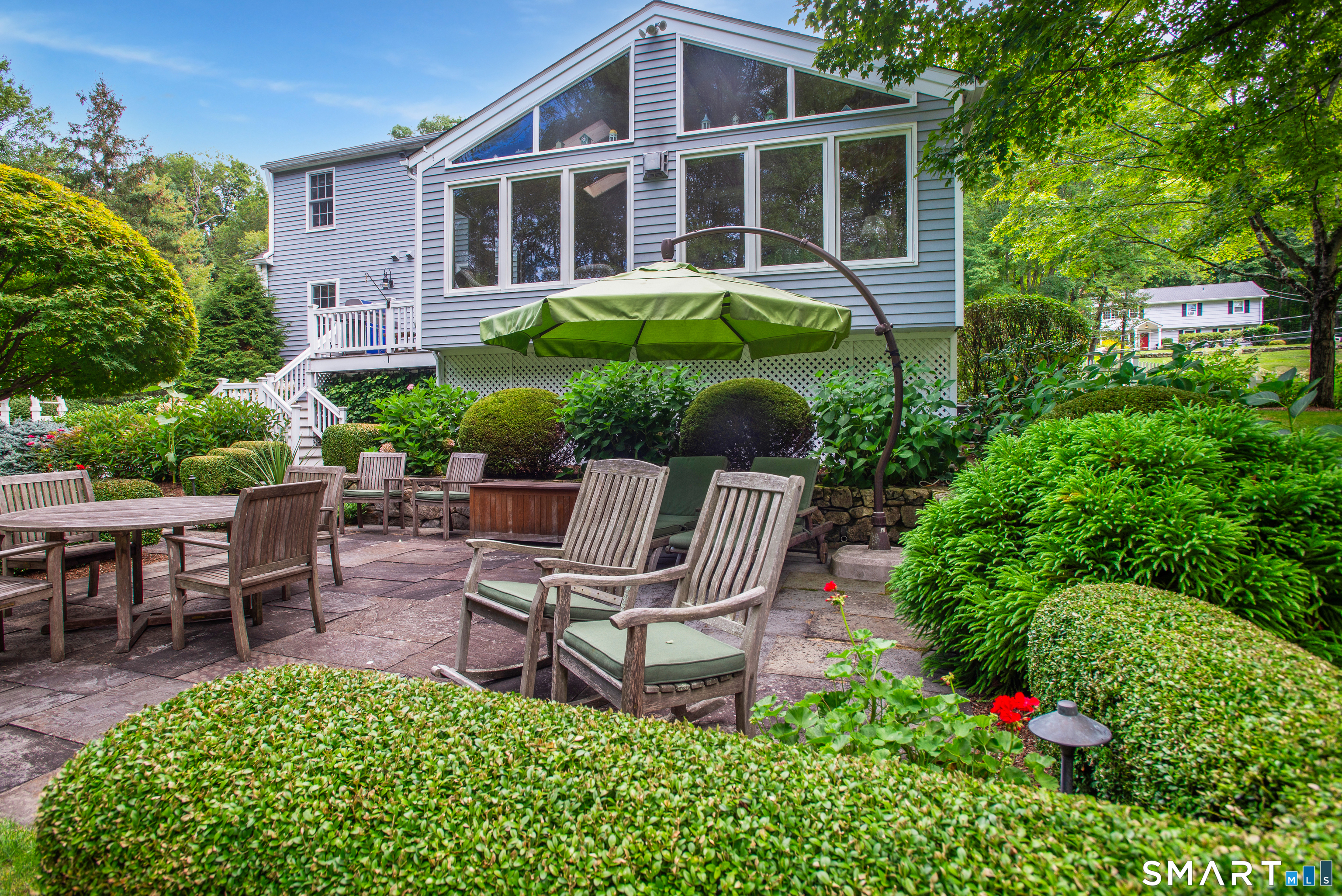 15 Twopence Road Ridgefield, CT 06877 - Photo 4 of 42 a backyard of a house with table and chairs