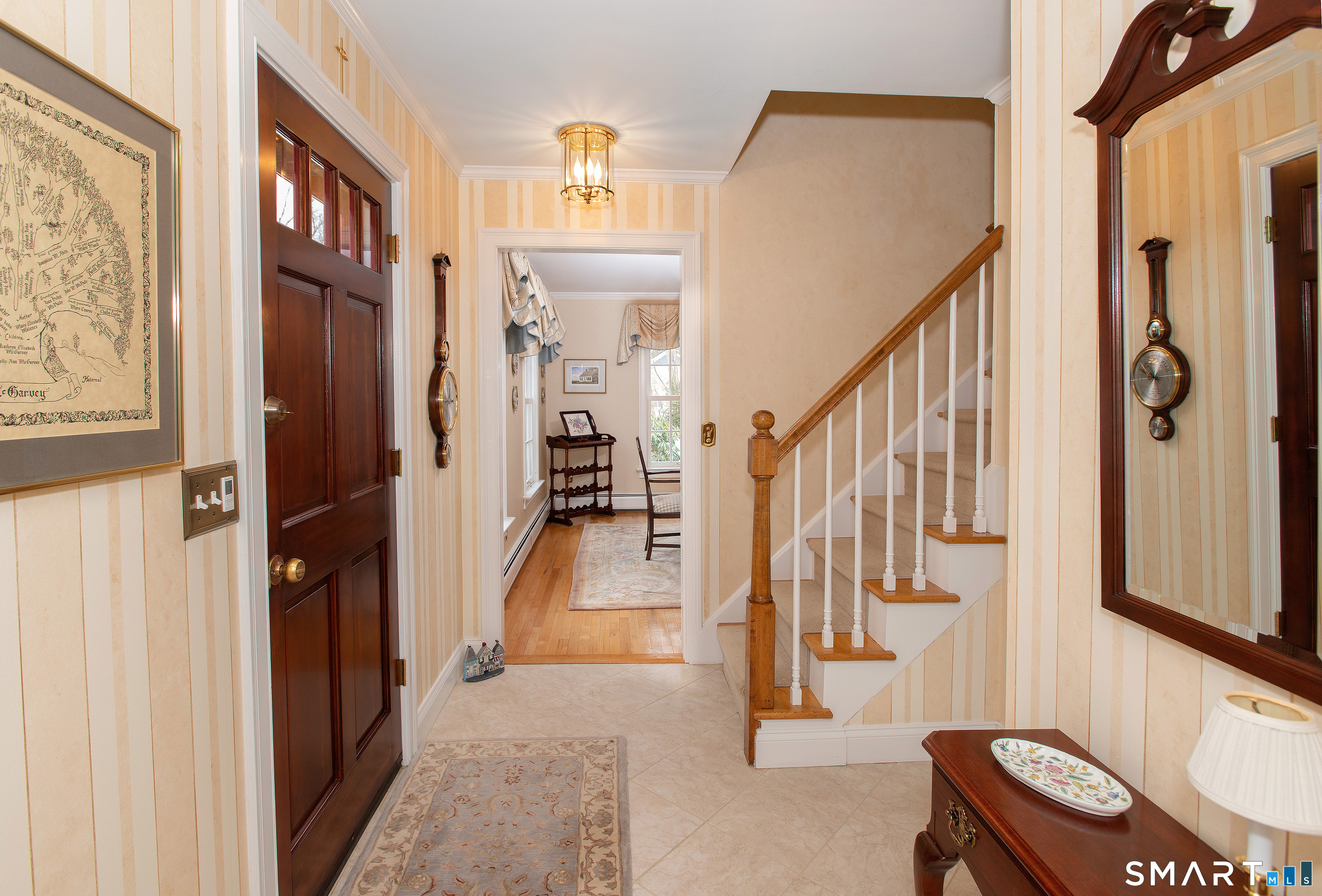 15 Twopence Road Ridgefield, CT 06877 - Photo 9 of 42 a view of an entryway with wooden floor and a livingroom