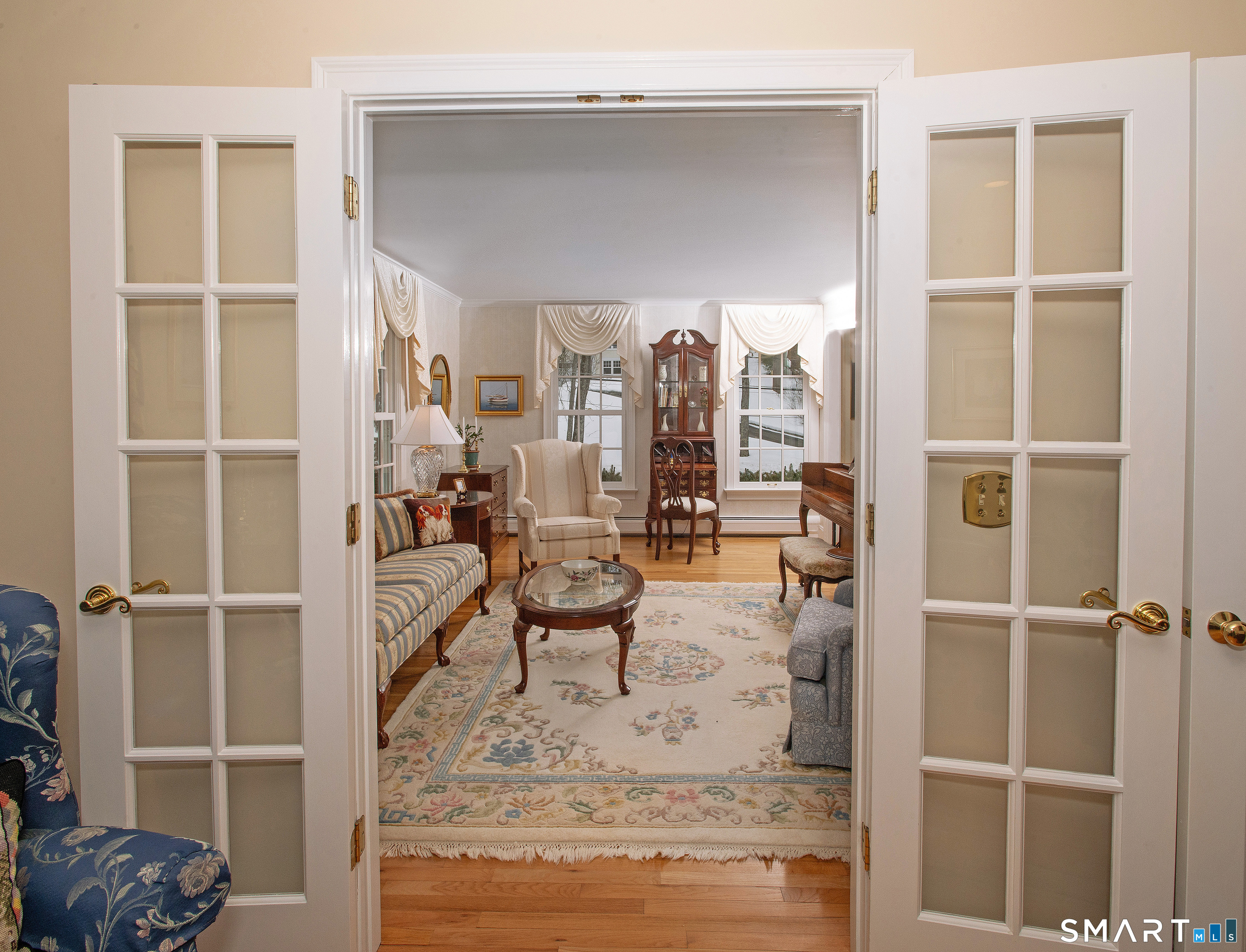 15 Twopence Road Ridgefield, CT 06877 - Photo 10 of 42 a living room with furniture a rug and a window