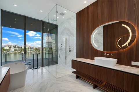 a bathroom with a sink double vanity and a mirror